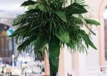 4 estilos centros de mesa con hojas verdes para fiestas